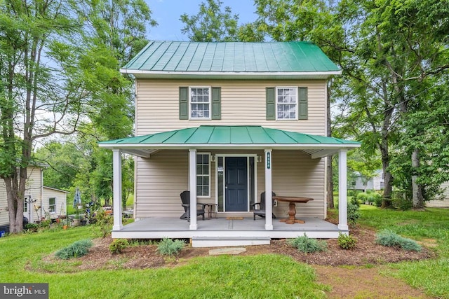 8558 Opal Rd, Warrenton, VA 20186 - view of front facade with a standing seam roof, a metal roof, a porch, and a front lawn