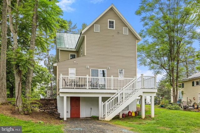 8558 Opal Rd, Warrenton, VA 20186 - back of property with stairway, a deck, a lawn, and a metal roof