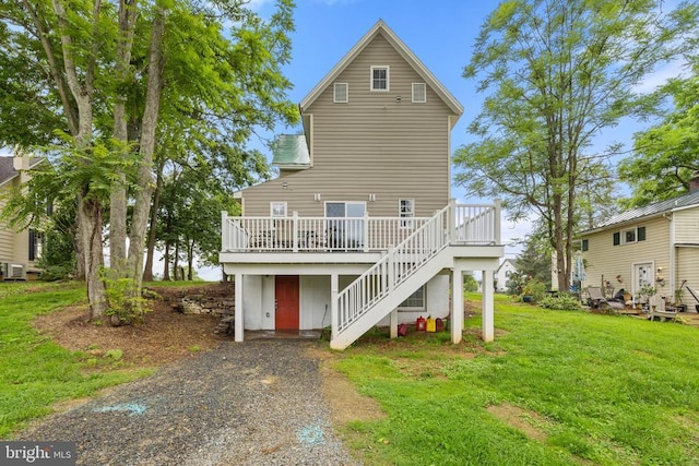 8558 Opal Rd, Warrenton, VA 20186 - rear view of house with stairway, a wooden deck, a lawn, and driveway