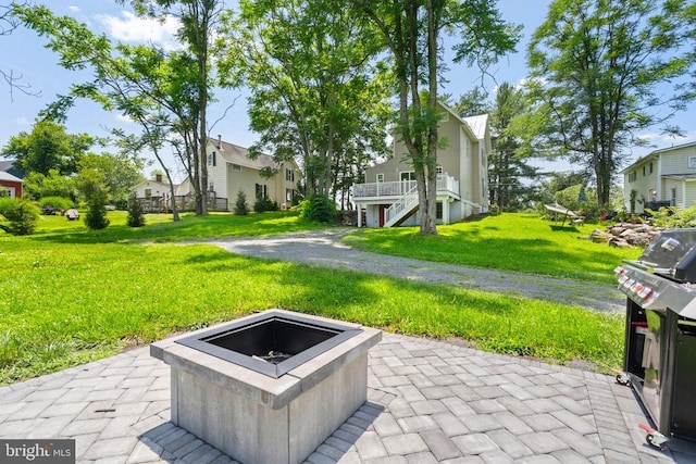 8558 Opal Rd, Warrenton, VA 20186 - view of patio with an outdoor fire pit, a grill, and a residential view
