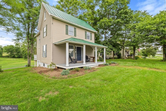 8558 Opal Rd, Warrenton, VA 20186 - view of front of property with a front yard, a metal roof, a porch, and a standing seam roof