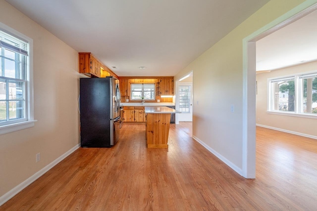 10999 Orkney Grade, Mount Jackson, VA 22842 - kitchen with freestanding refrigerator, light wood finished floors, light countertops, and baseboards