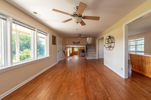 10999 Orkney Grade, Mount Jackson, VA 22842 - unfurnished living room featuring wood finished floors, baseboards, stairway, and a ceiling fan