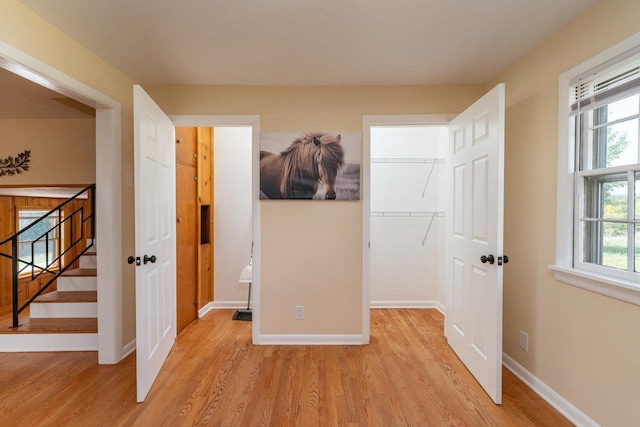 10999 Orkney Grade, Mount Jackson, VA 22842 - unfurnished bedroom with light wood-style flooring, baseboards, a walk in closet, and a closet