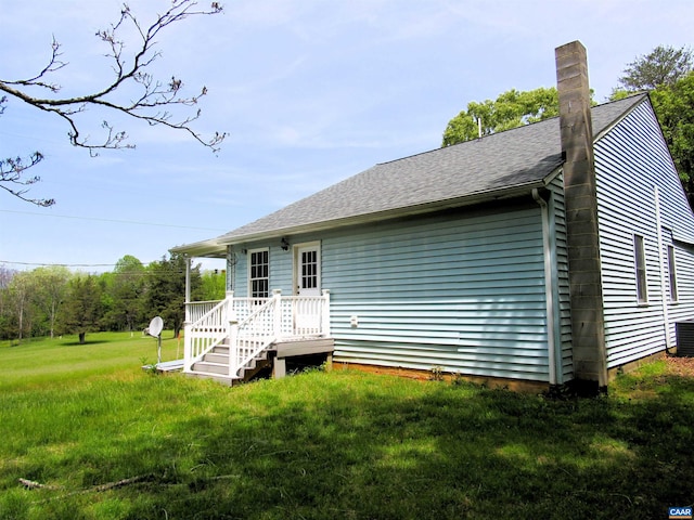 238 My Way, Amherst, VA 24521 - rear view of property featuring a yard, a chimney, roof with shingles, and cooling unit
