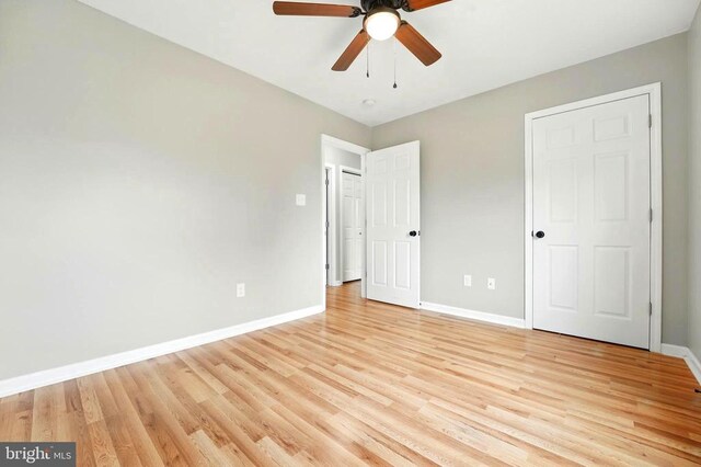 845 Seville Rd, Rochelle, VA 22738 - unfurnished bedroom featuring baseboards, light wood finished floors, and ceiling fan