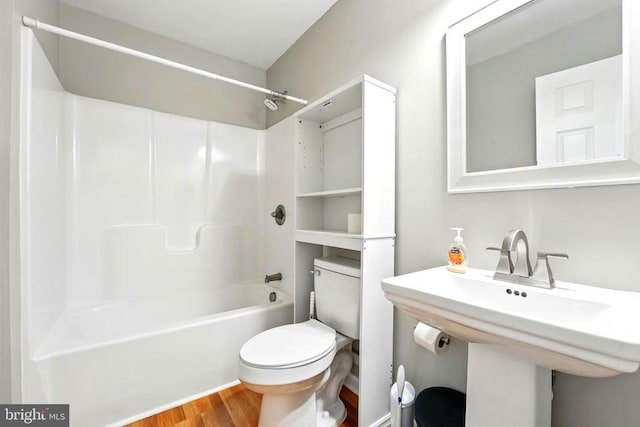 845 Seville Rd, Rochelle, VA 22738 - full bathroom featuring toilet, wood finished floors, washtub / shower combination, and a sink