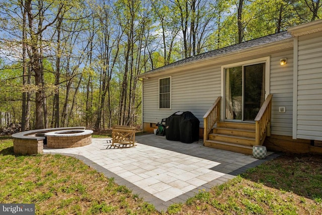 view of patio / terrace featuring a fire pit and entry steps