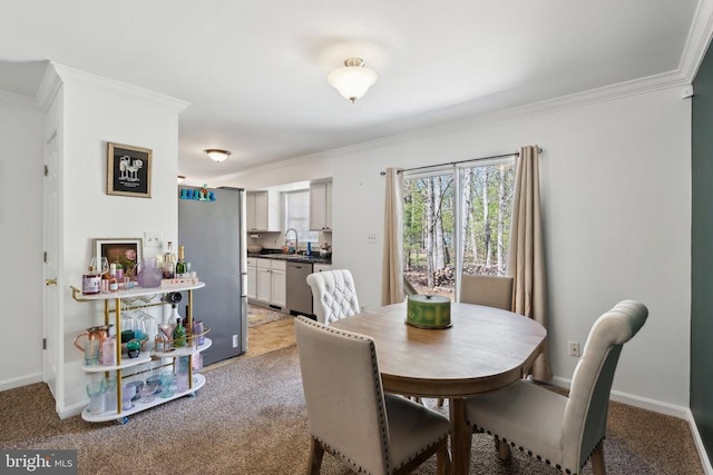 dining space with baseboards, light colored carpet, and ornamental molding