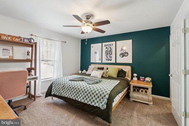 bedroom with baseboards, carpet, and a ceiling fan