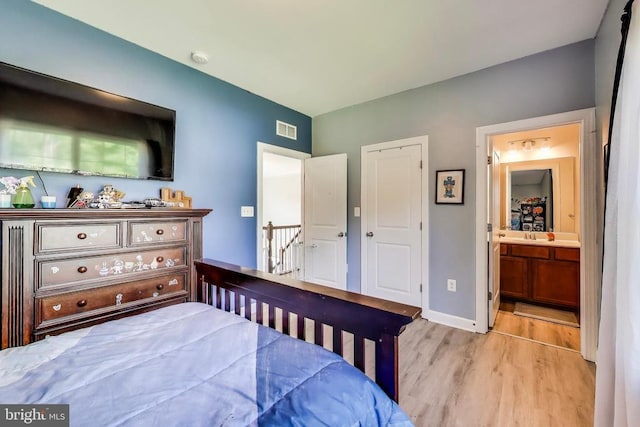 13001 Wipple Ct, Fredericksburg, VA 22407 - bedroom featuring wood finished floors and ensuite bath