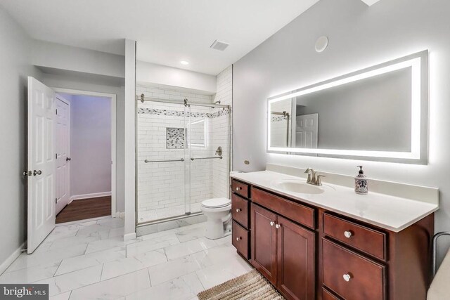 13001 Wipple Ct, Fredericksburg, VA 22407 - bathroom featuring marble finish floors, a stall shower, vanity, and recessed lighting