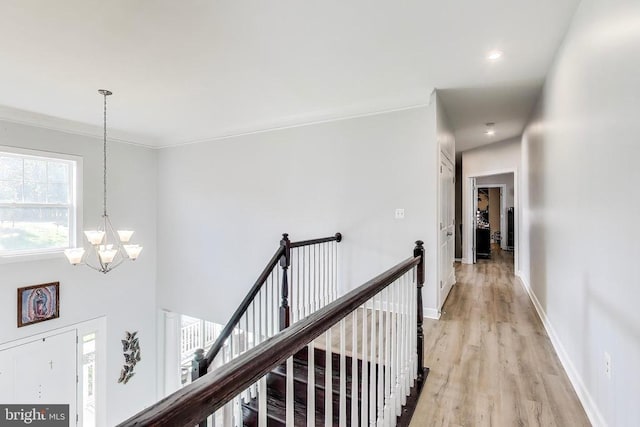 13001 Wipple Ct, Fredericksburg, VA 22407 - hallway with light wood finished floors, a chandelier, ornamental molding, and recessed lighting