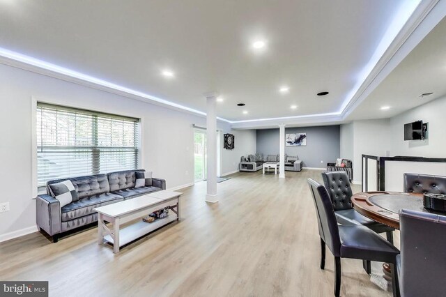 13001 Wipple Ct, Fredericksburg, VA 22407 - living room featuring light wood-style floors, ornate columns, a raised ceiling, and recessed lighting