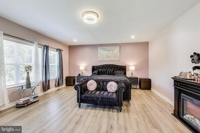 13001 Wipple Ct, Fredericksburg, VA 22407 - bedroom featuring light wood finished floors, recessed lighting, and a glass covered fireplace