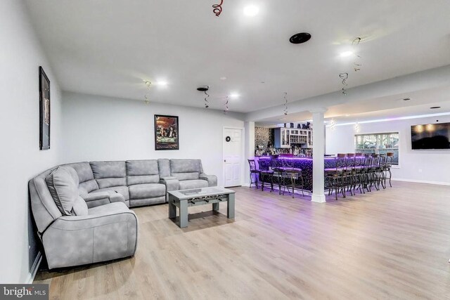 13001 Wipple Ct, Fredericksburg, VA 22407 - living area with bar area, wood finished floors, and decorative columns