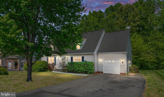 12107 Knight Ct, Fredericksburg, VA 22407 - cape cod-style house featuring an attached garage, asphalt driveway, and a front lawn