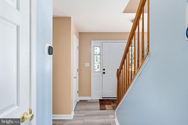 12107 Knight Ct, Fredericksburg, VA 22407 - foyer with wood finished floors, stairway, and baseboards