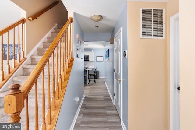 12107 Knight Ct, Fredericksburg, VA 22407 - stairway featuring wood finished floors and baseboards
