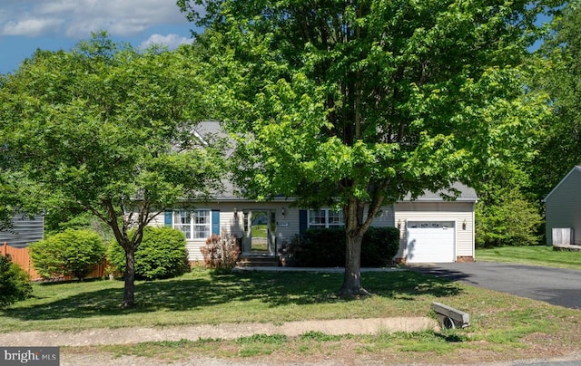 12107 Knight Ct, Fredericksburg, VA 22407 - view of property hidden behind natural elements featuring driveway and a garage
