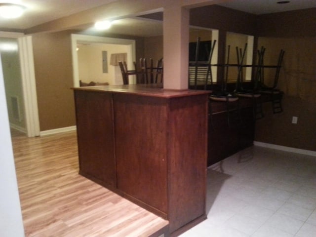 1111 Maple St, Staunton, VA 24401 - kitchen with dark countertops and light wood finished floors