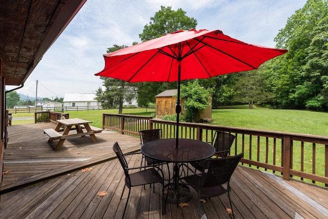 35 Bottom Rd S, Raphine, VA 24472 - wooden terrace featuring outdoor dining area, a storage unit, and a yard