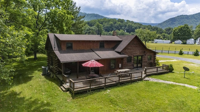 35 Bottom Rd S, Raphine, VA 24472 - rear view of house with log siding, a deck with mountain view, a chimney, and a shingled roof