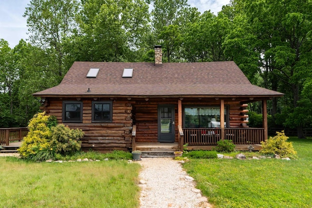 35 Bottom Rd S, Raphine, VA 24472 - log cabin with log siding, roof with shingles, a chimney, a front lawn, and a porch