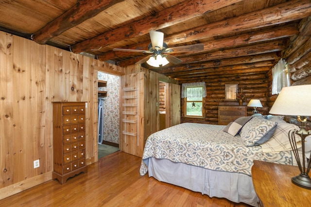 35 Bottom Rd S, Raphine, VA 24472 - bedroom featuring wood finished floors, log walls, and a wood ceiling with exposed beams