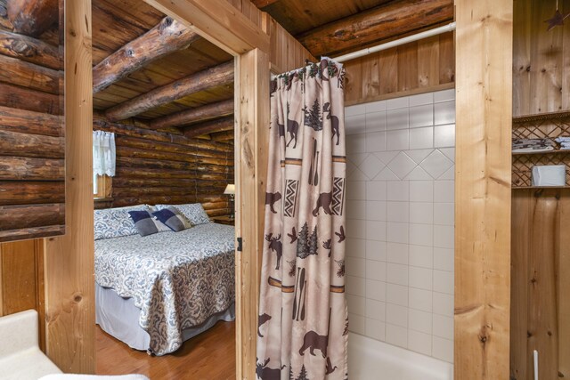 35 Bottom Rd S, Raphine, VA 24472 - bathroom with log walls, a wood ceiling with exposed beams, and wood finished floors