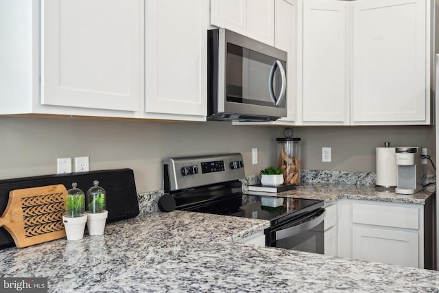 115 Rae Ct, Luray, VA 22835 - kitchen featuring stainless steel appliances, white cabinetry, and light stone countertops
