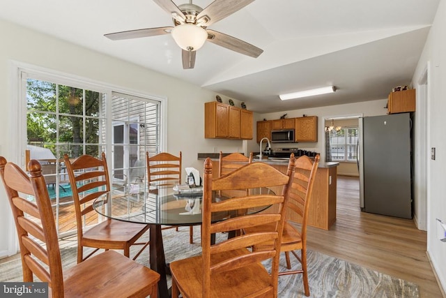 12224 Stonehenge Dr, Fredericksburg, VA 22407 - dining area featuring light wood-type flooring, lofted ceiling, and ceiling fan