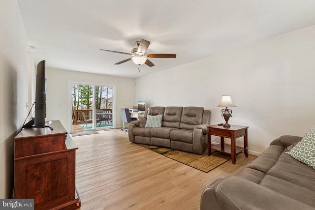 12224 Stonehenge Dr, Fredericksburg, VA 22407 - living room with light wood-style floors, a ceiling fan, and baseboards