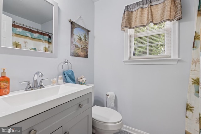 12224 Stonehenge Dr, Fredericksburg, VA 22407 - full bath with toilet, vanity, baseboards, and a shower with shower curtain