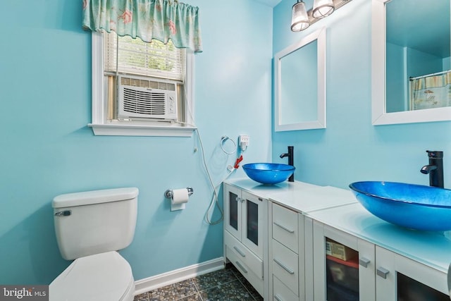 12224 Stonehenge Dr, Fredericksburg, VA 22407 - full bath with toilet, baseboards, cooling unit, double vanity, and wine cooler