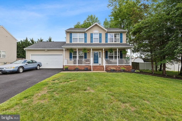 12224 Stonehenge Dr, Fredericksburg, VA 22407 - view of front facade with a porch, asphalt driveway, an attached garage, and a front yard