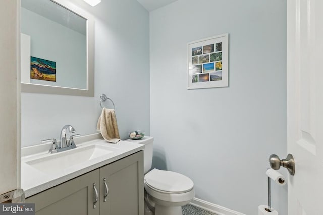 12224 Stonehenge Dr, Fredericksburg, VA 22407 - bathroom featuring vanity, toilet, and baseboards