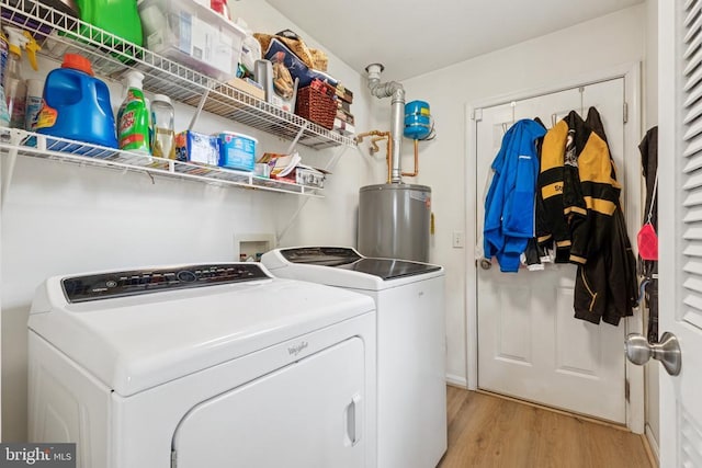 12224 Stonehenge Dr, Fredericksburg, VA 22407 - laundry area featuring washer and dryer, gas water heater, and light wood-style floors