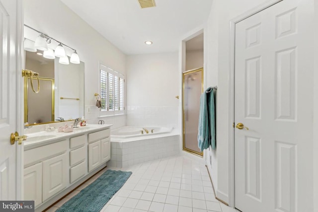 full bathroom with a garden tub, double vanity, tile patterned floors, visible vents, and a shower stall