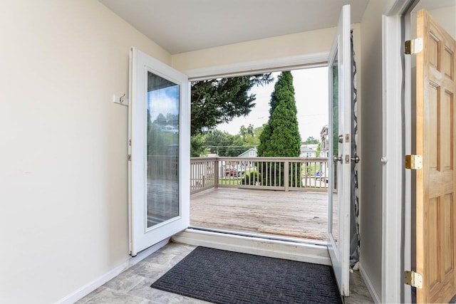 entryway featuring baseboards