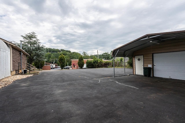 view of parking with a detached garage