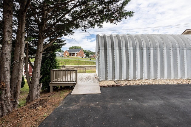 view of property's community featuring a wooden deck