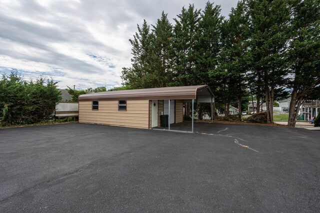 exterior space featuring driveway and a carport