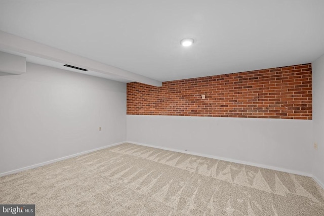 47 Marwood Dr, Palmyra, VA 22963 - finished below grade area with carpet flooring and brick wall