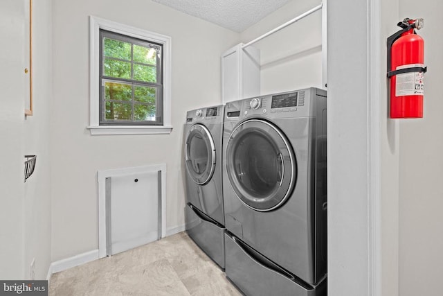 47 Marwood Dr, Palmyra, VA 22963 - washroom with washer and clothes dryer, cabinet space, and a textured ceiling