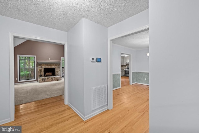 47 Marwood Dr, Palmyra, VA 22963 - hallway featuring a textured ceiling and light wood finished floors