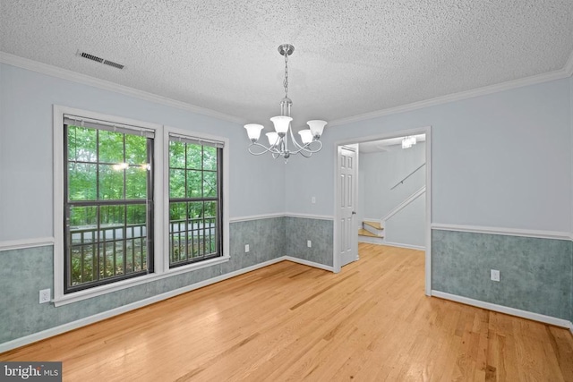 47 Marwood Dr, Palmyra, VA 22963 - unfurnished room with wood finished floors, a textured ceiling, a chandelier, ornamental molding, and stairs
