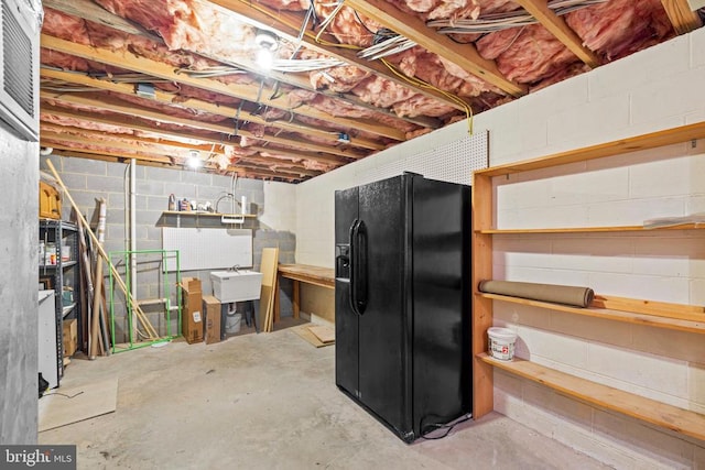 47 Marwood Dr, Palmyra, VA 22963 - unfinished basement featuring black refrigerator with ice dispenser and concrete block wall