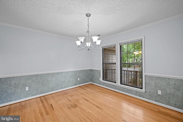 47 Marwood Dr, Palmyra, VA 22963 - unfurnished room with wood finished floors, a textured ceiling, a chandelier, ornamental molding, and wainscoting