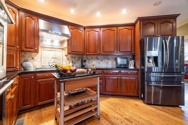 5090 Springhouse Cir, Rockingham, VA 22802 - kitchen with crown molding, wall chimney exhaust hood, stainless steel refrigerator with ice dispenser, and backsplash
